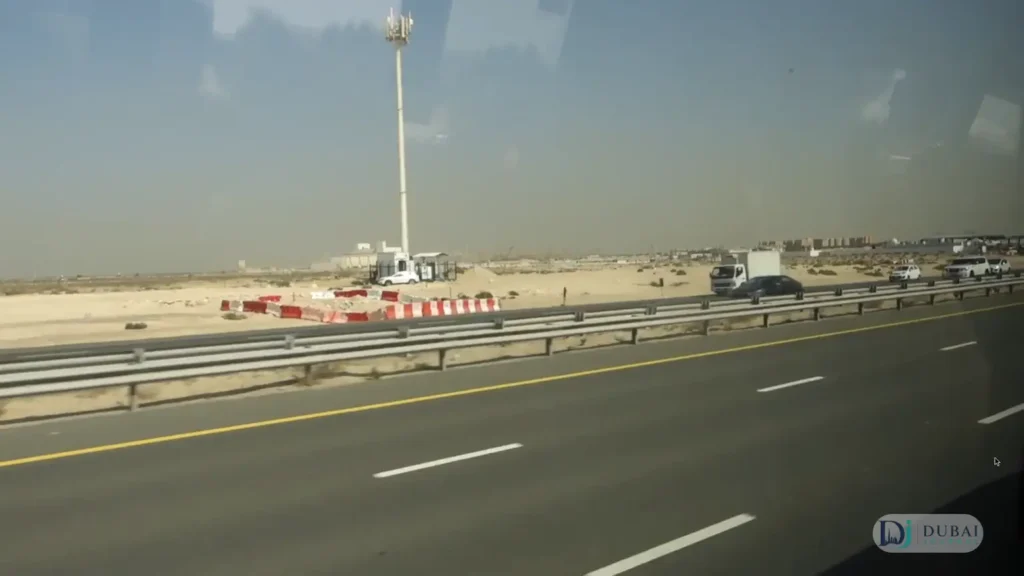 Desert highway view from an Abu Dhabi–Sharjah intercity bus