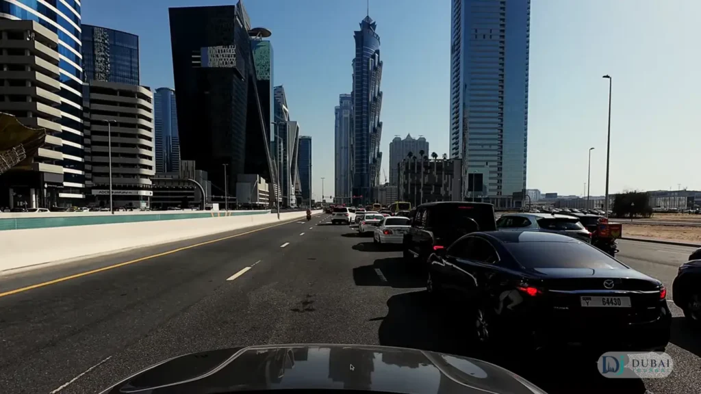 Driving on Sheikh Zayed Road in Dubai past modern towers