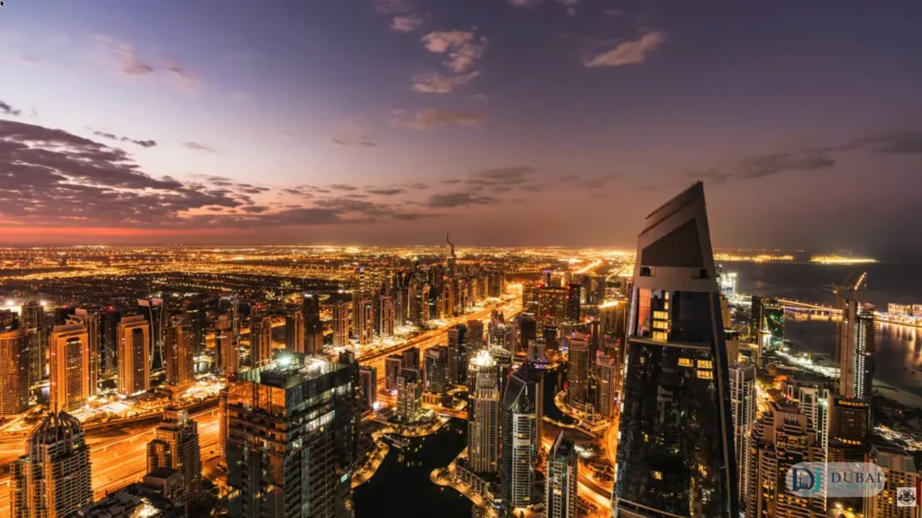 Dubai Marina skyscrapers at dusk with city lights