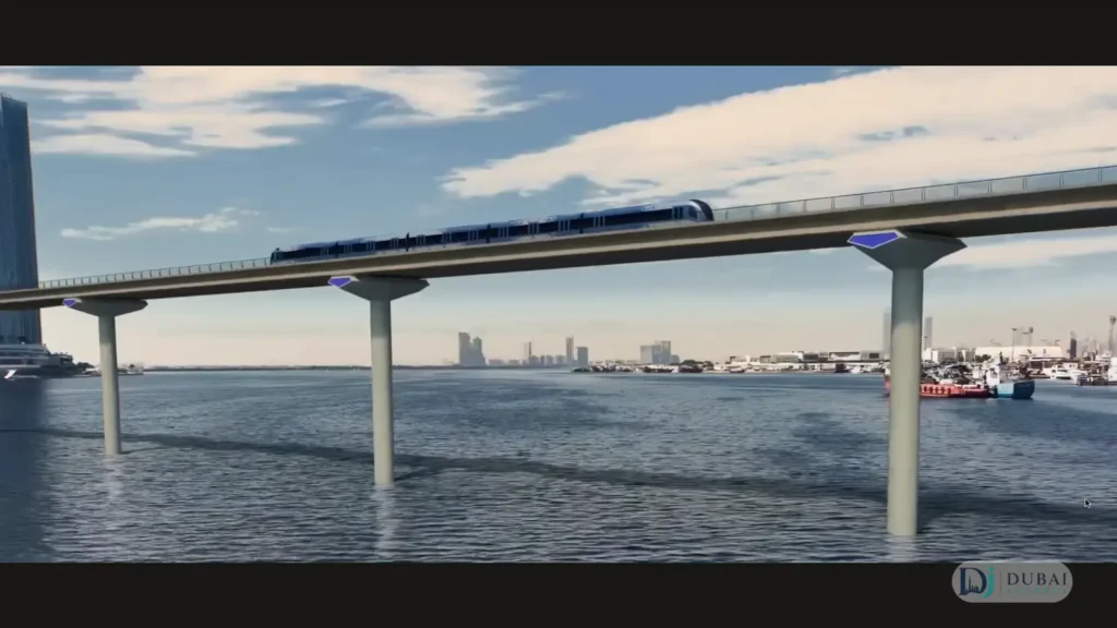 Dubai Metro Blue Line train crossing Dubai Creek on the elevated viaduct