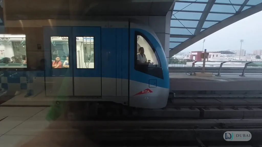 Dubai Metro Green Line Alstom train arriving at Stadium station