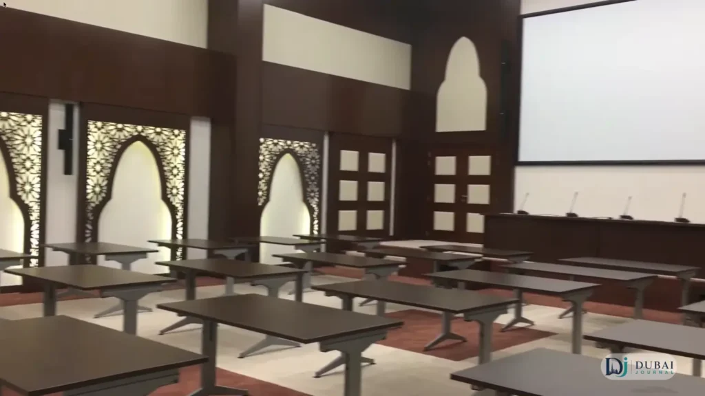 Inside a Dubai courtroom with Islamic arches and seating