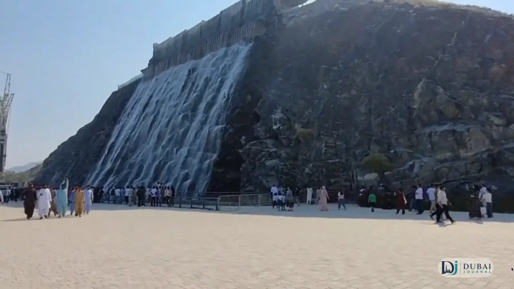 Khorfakkan waterfall with visitors at the base