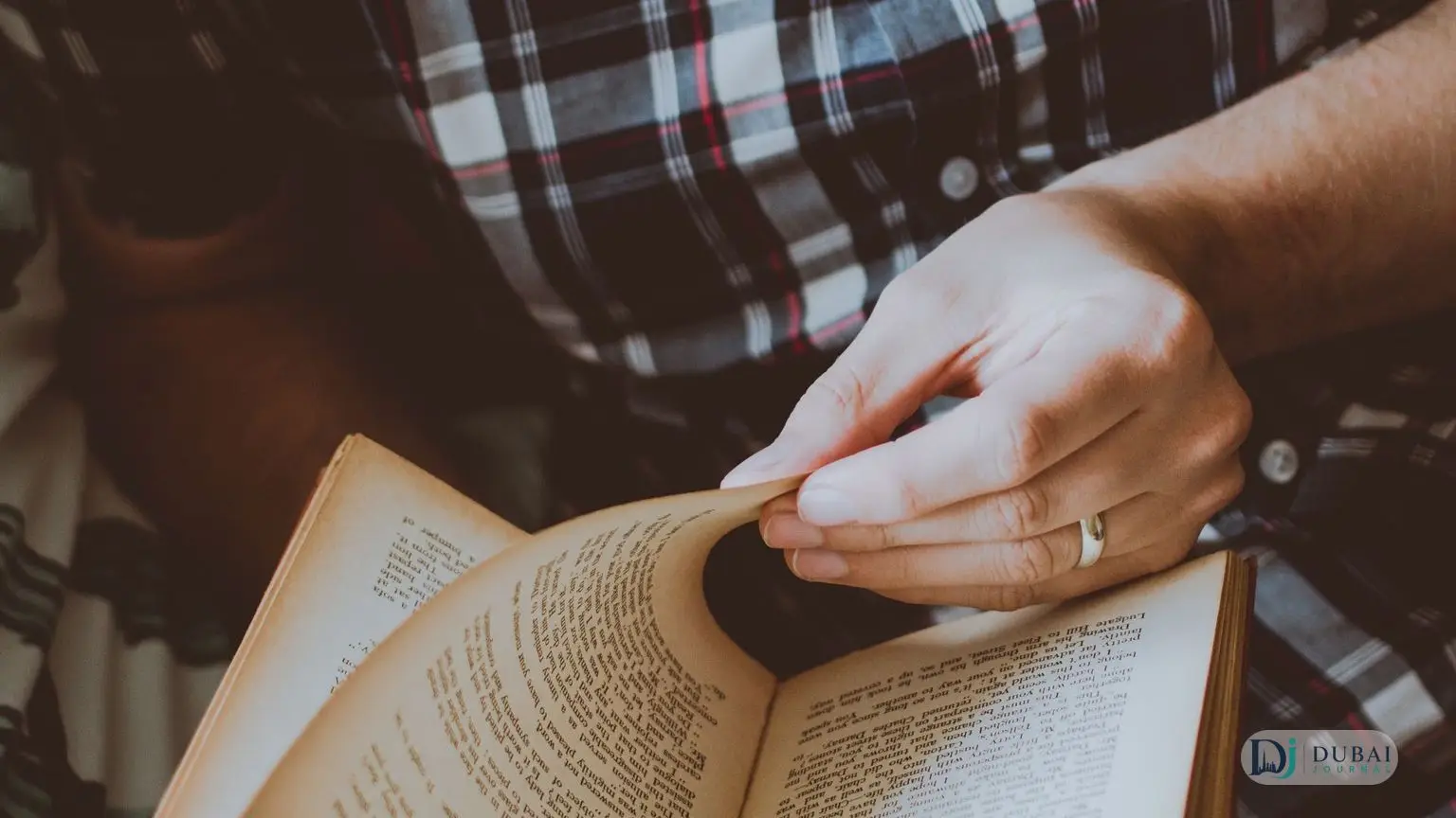 Man reading an open book