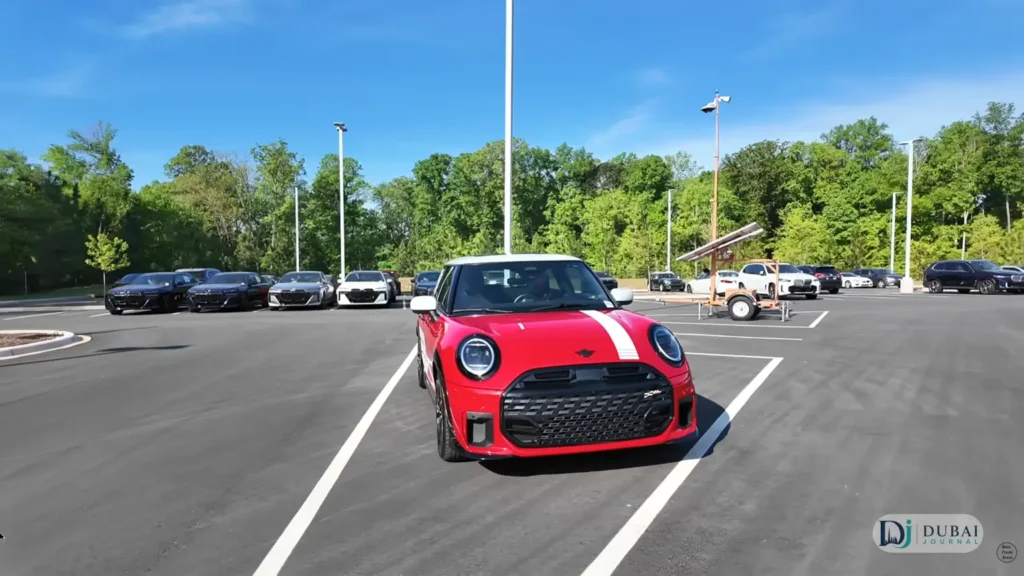 Red 2026 MINI Cooper JCW front view in dealer lot