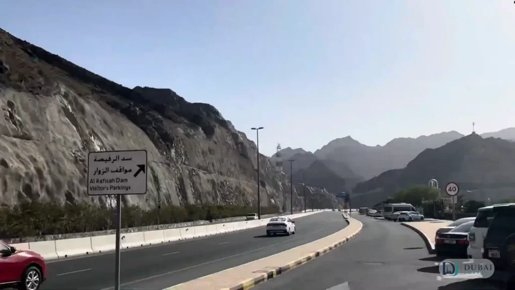 Visitor parking road and signage at Al Rafisah Dam, Khorfakkan